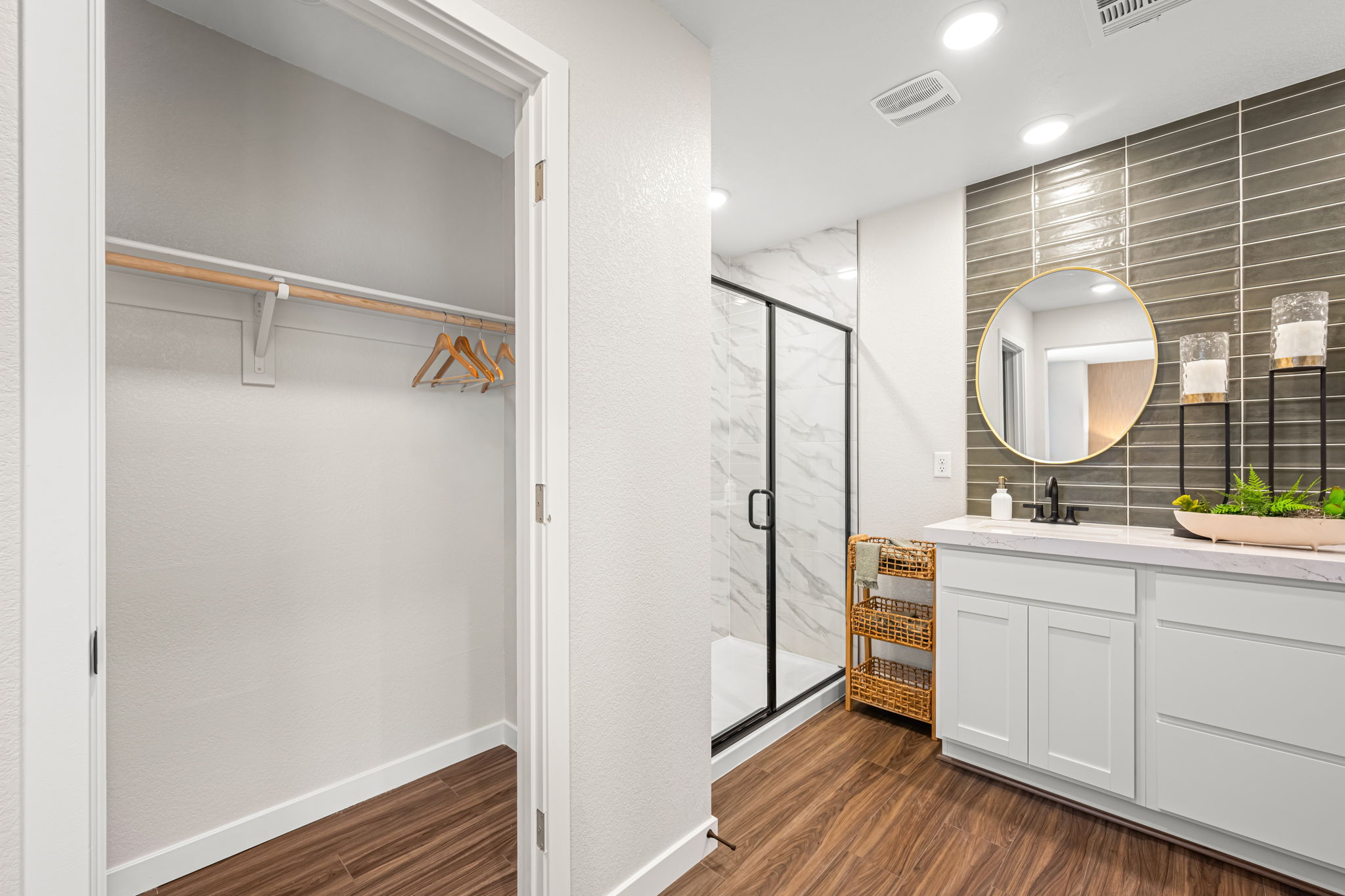 A bathroom with a mirror and a sink.