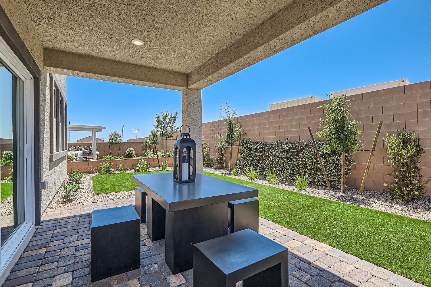 A table and chairs outside a building.