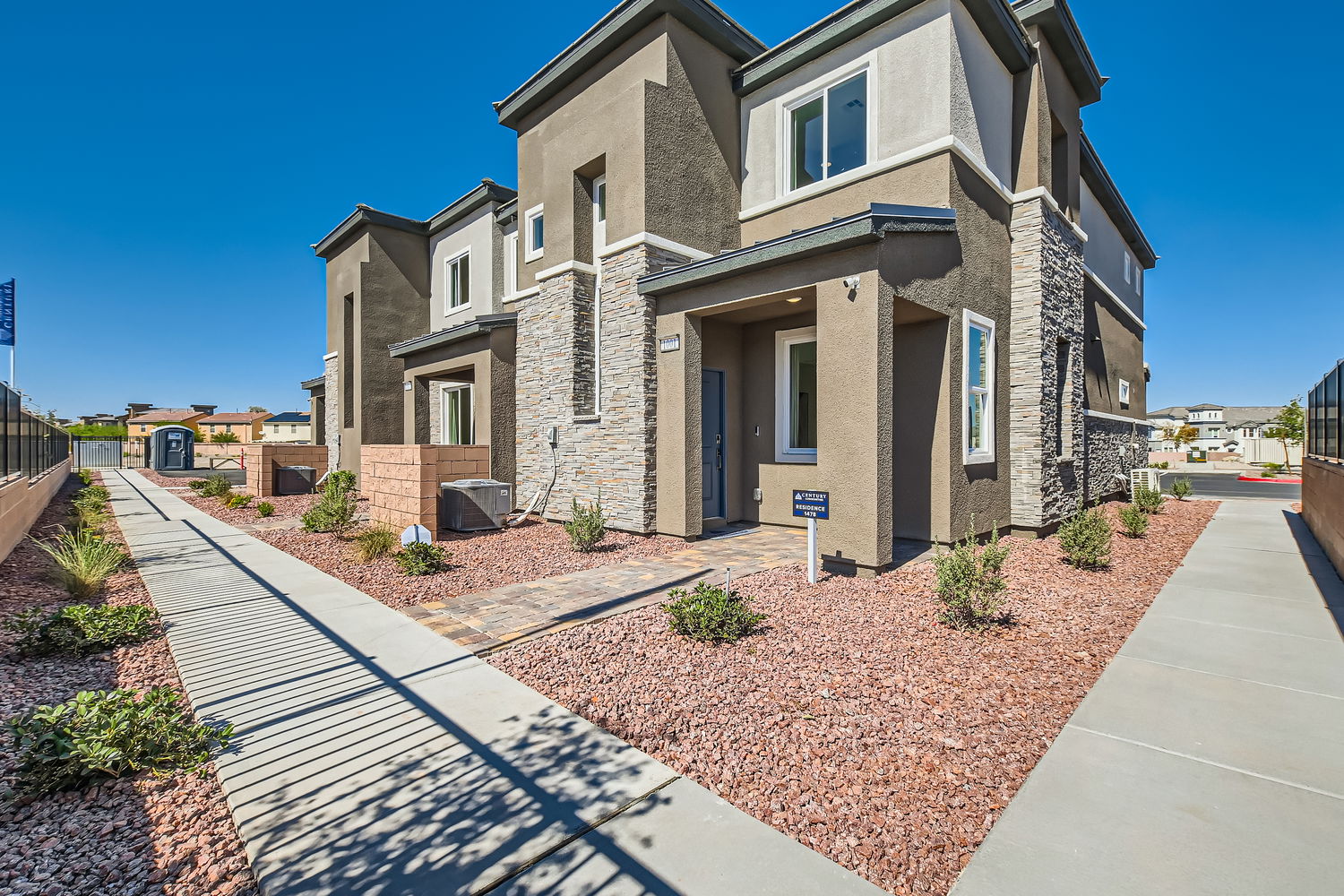 A brick building with a brick walkway.