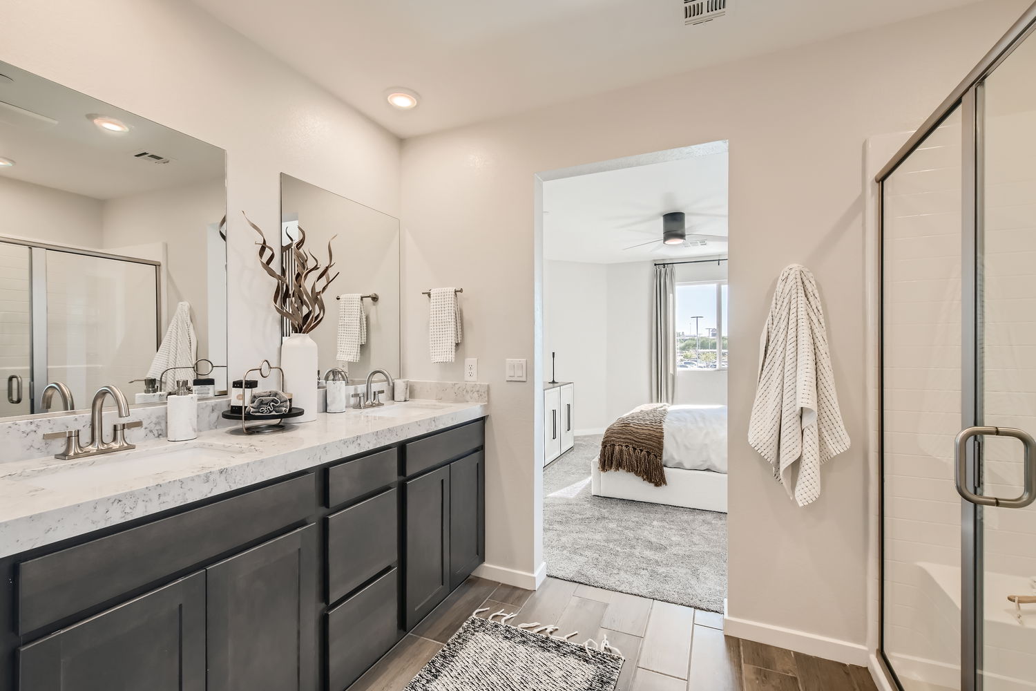 A bathroom with a shower and sink.