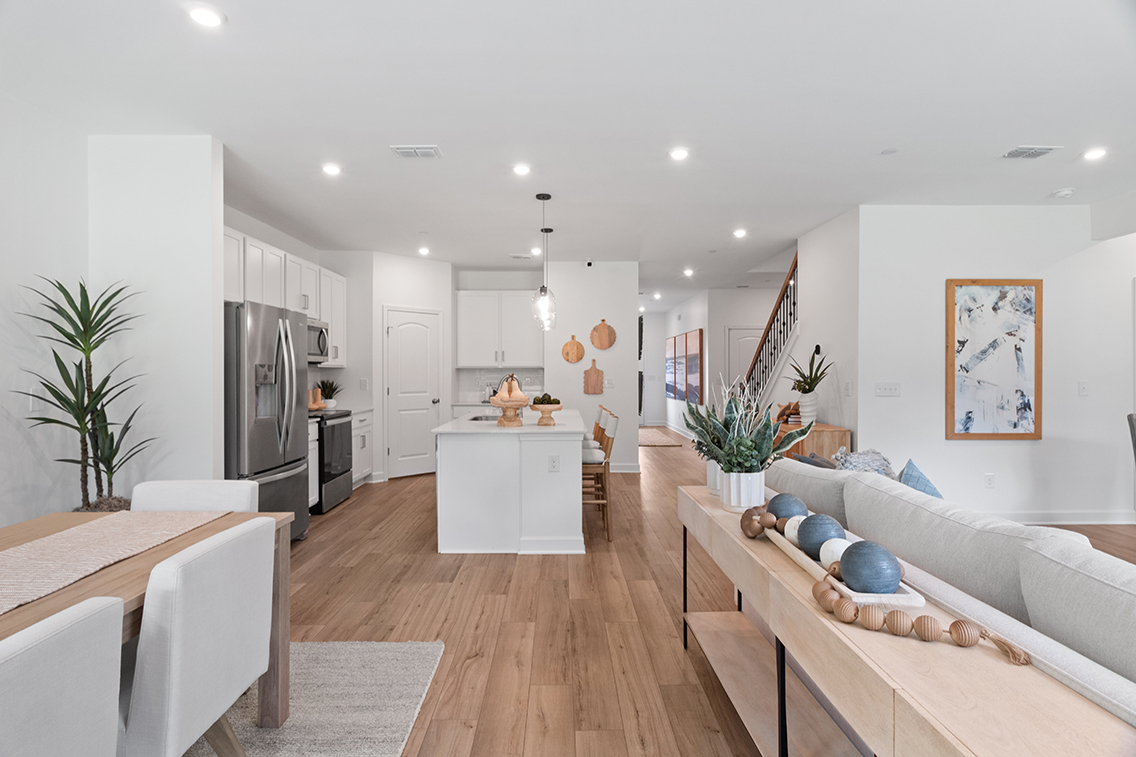 A living room with a couch and a table.