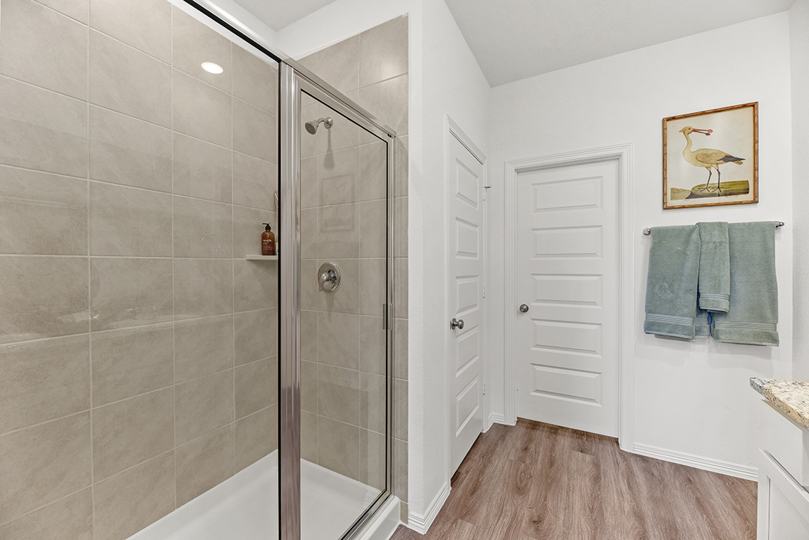 A bathroom with a glass shower.