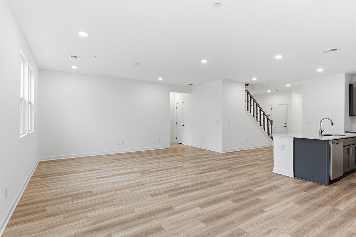 A kitchen with white walls.