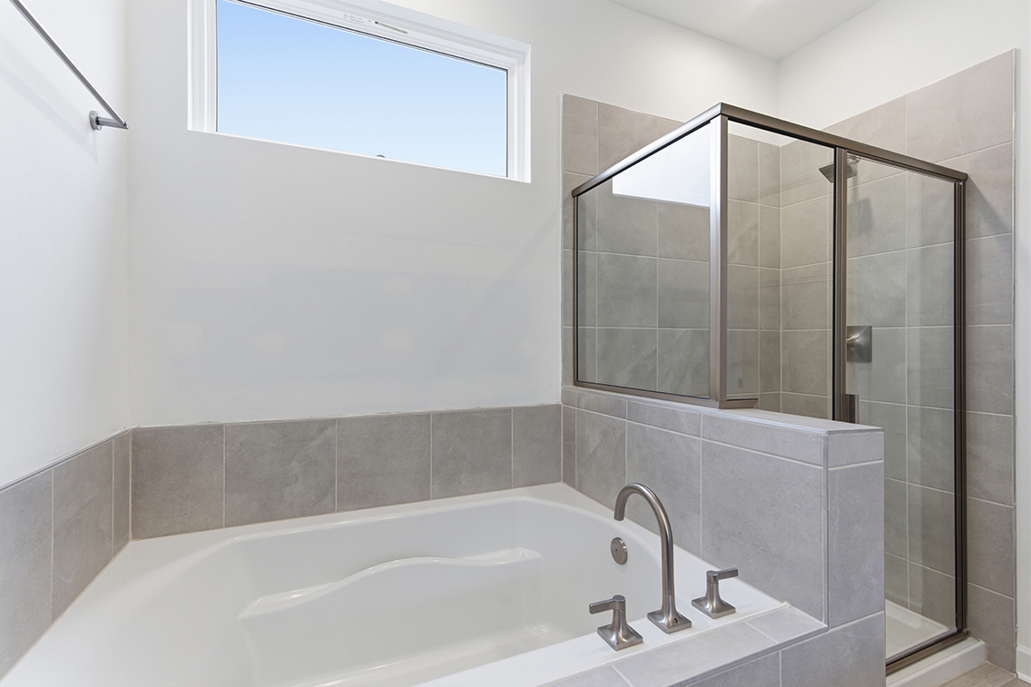 A bathroom with a glass shower.