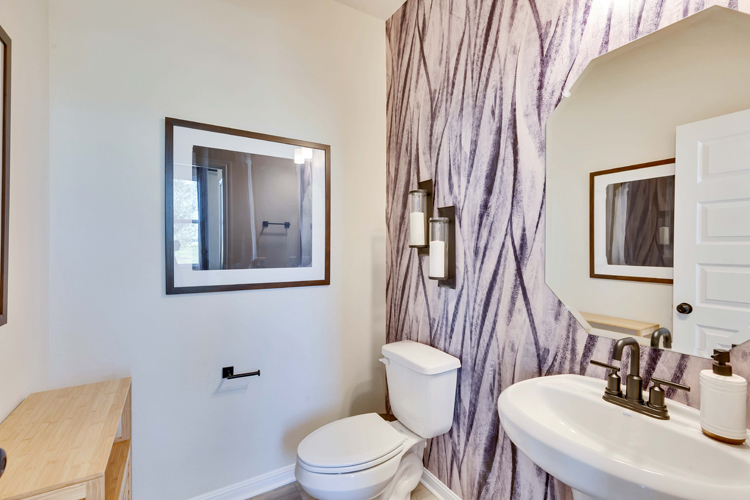 A bathroom with a toilet and sink.