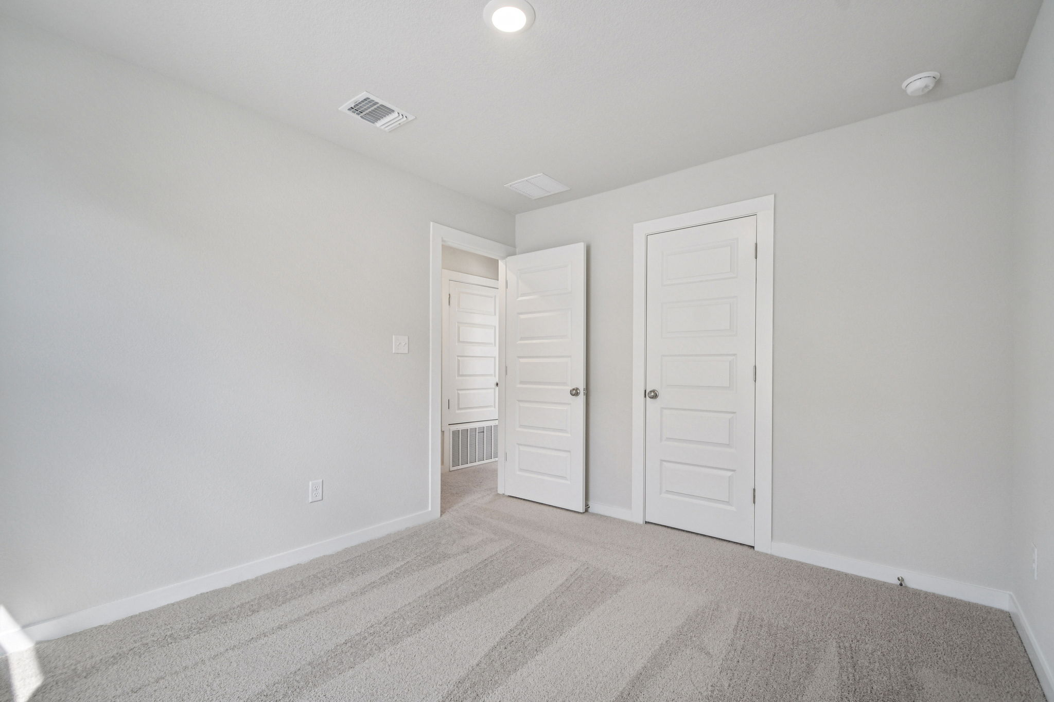 A room with white doors.