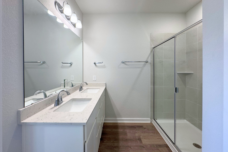 A bathroom with a glass shower.