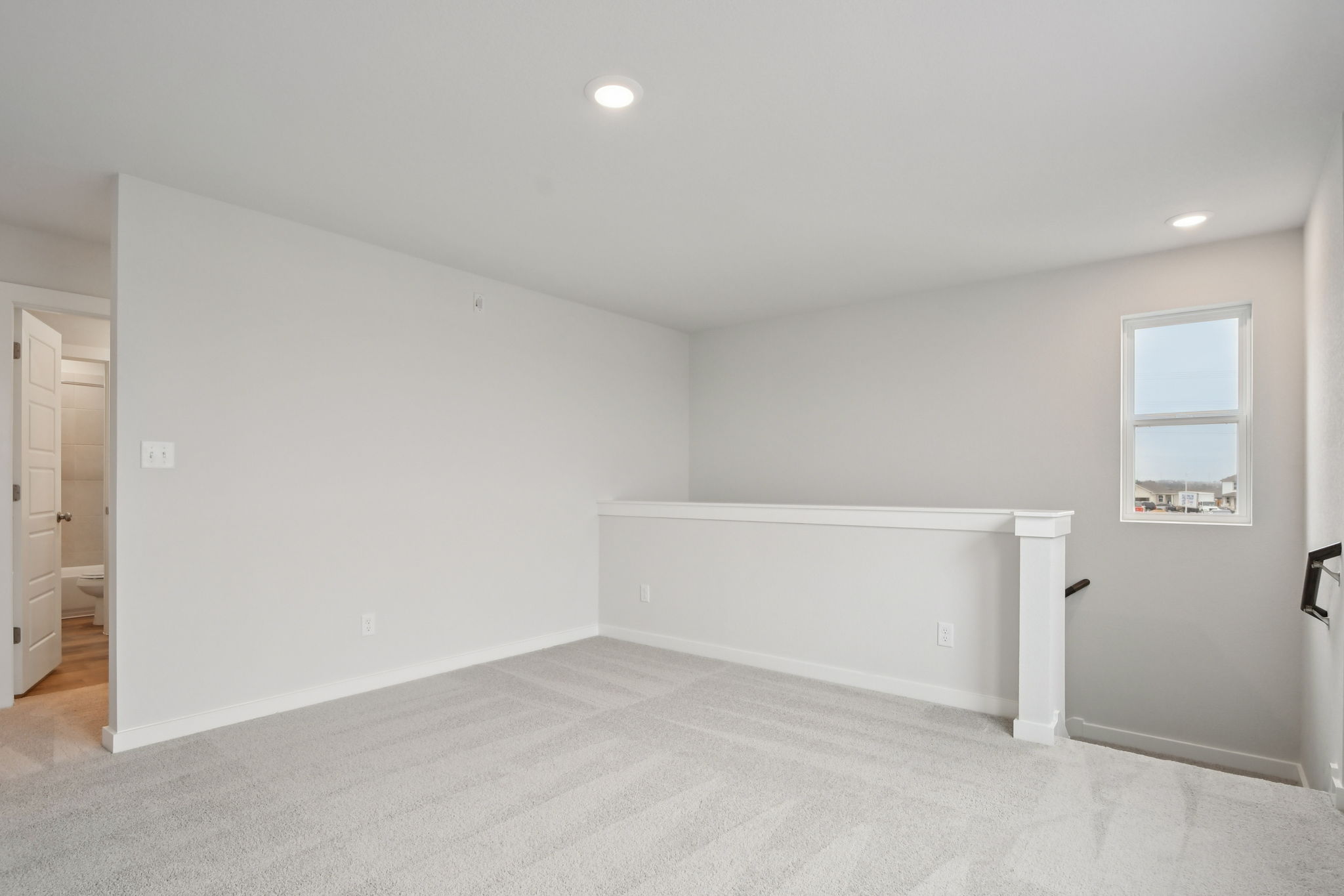 A room with a white wall and a white floor.