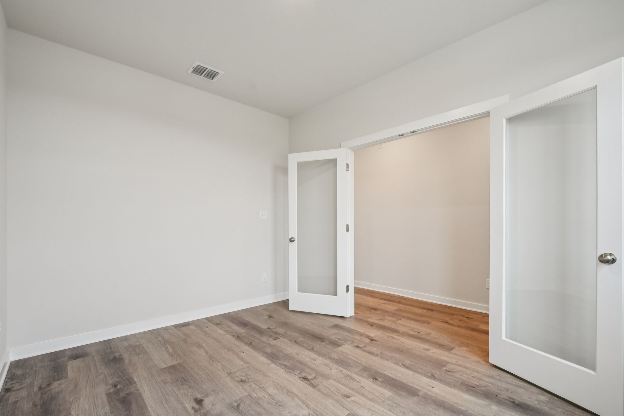 A room with white doors.