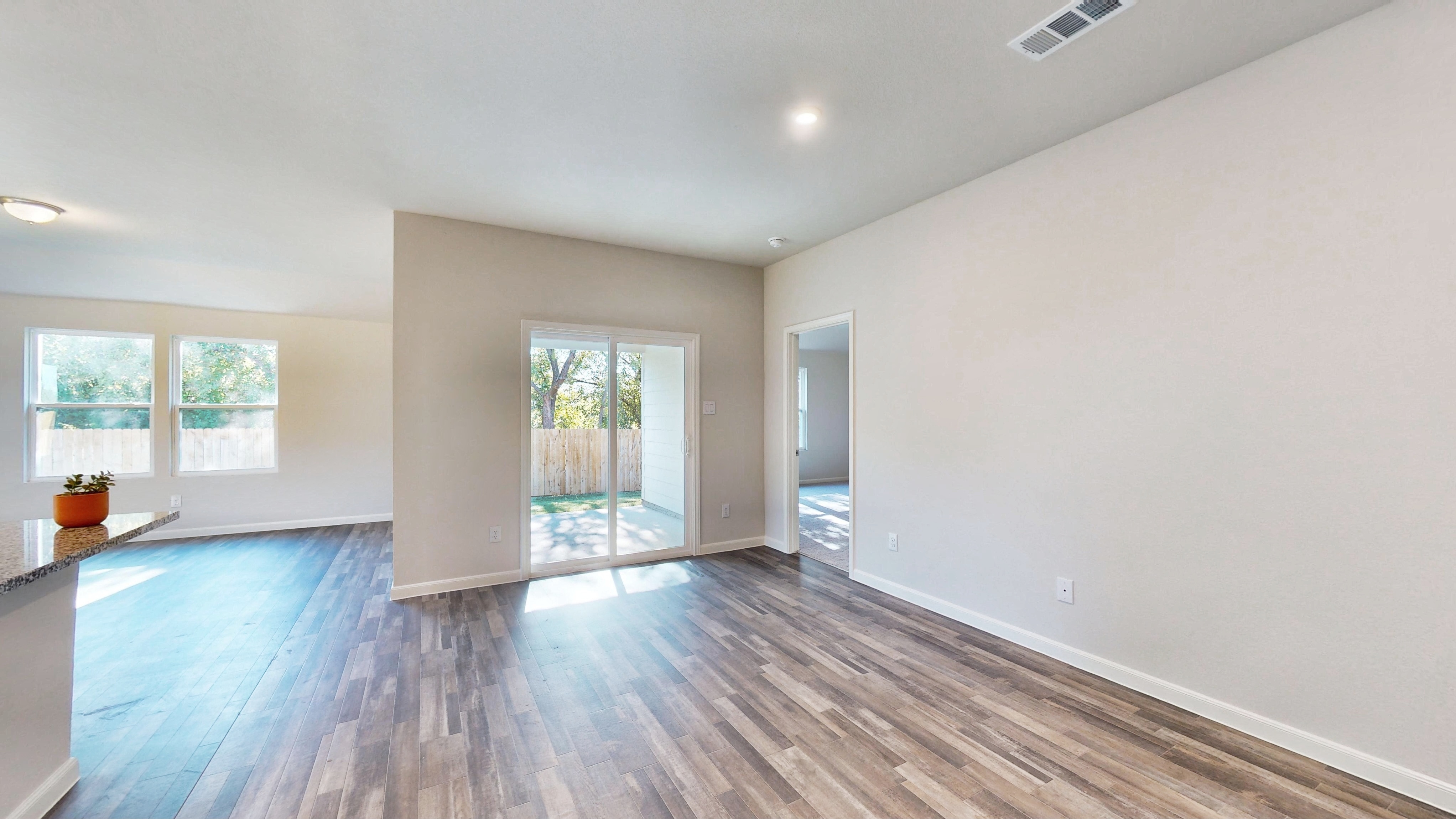 A room with a wood floor and a wood floor with a wood floor.