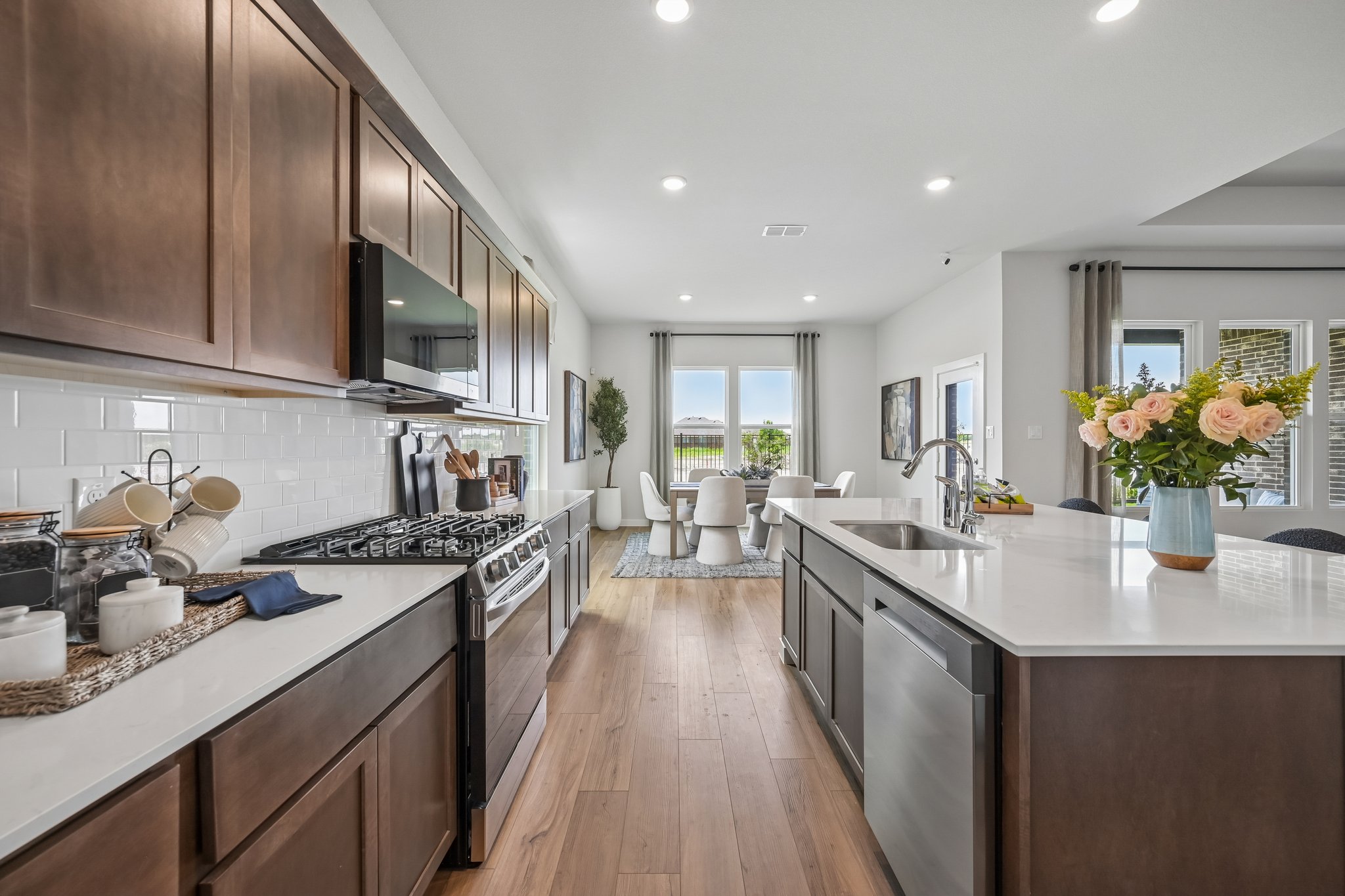 A kitchen with wooden cabinets.