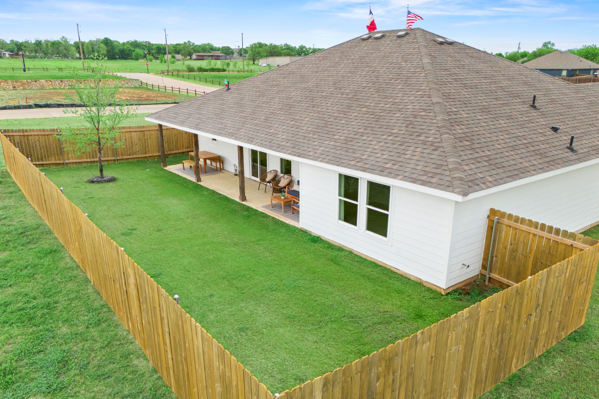 A house with a grass yard.