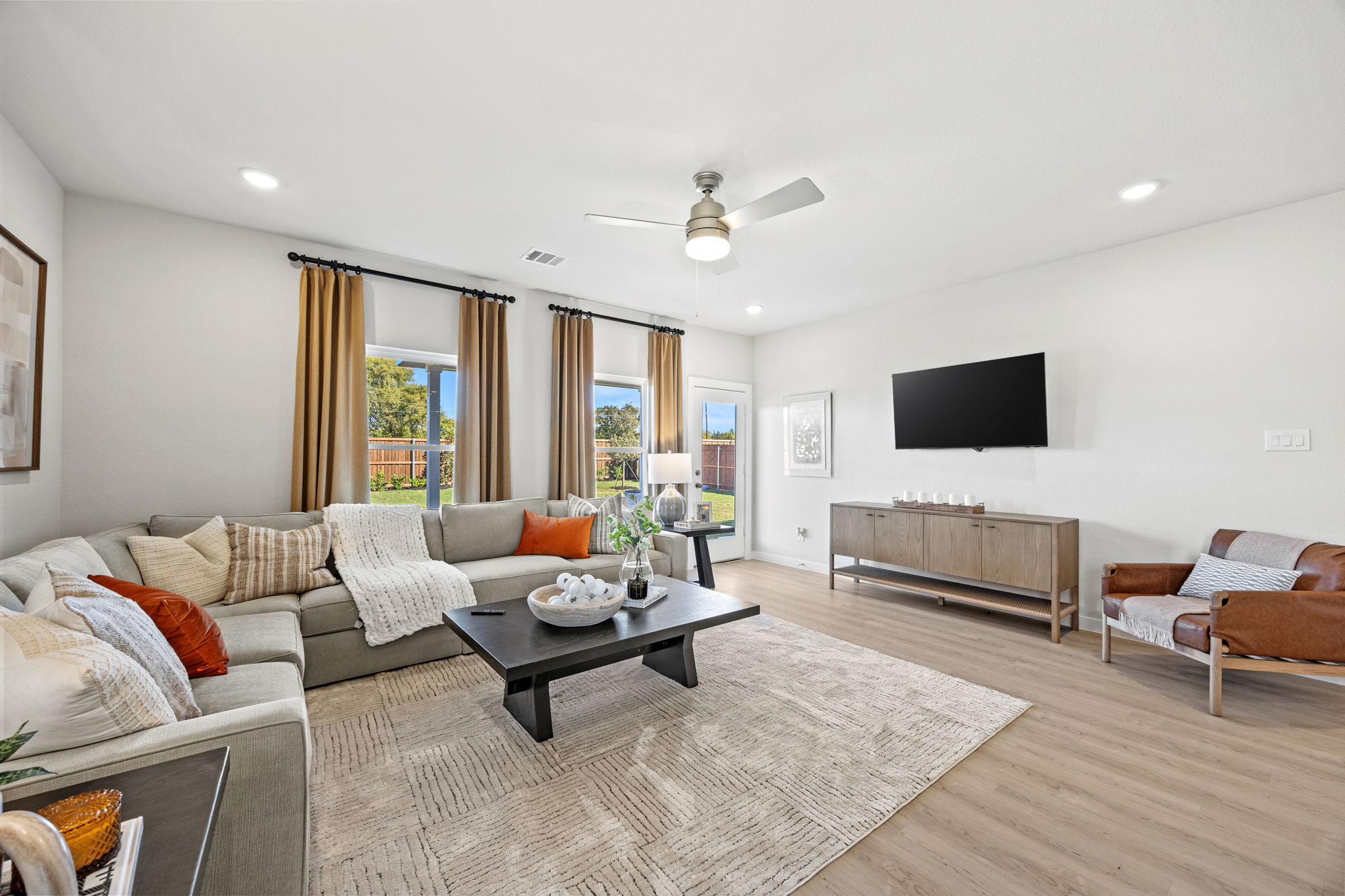 A living room with a tv and couches.