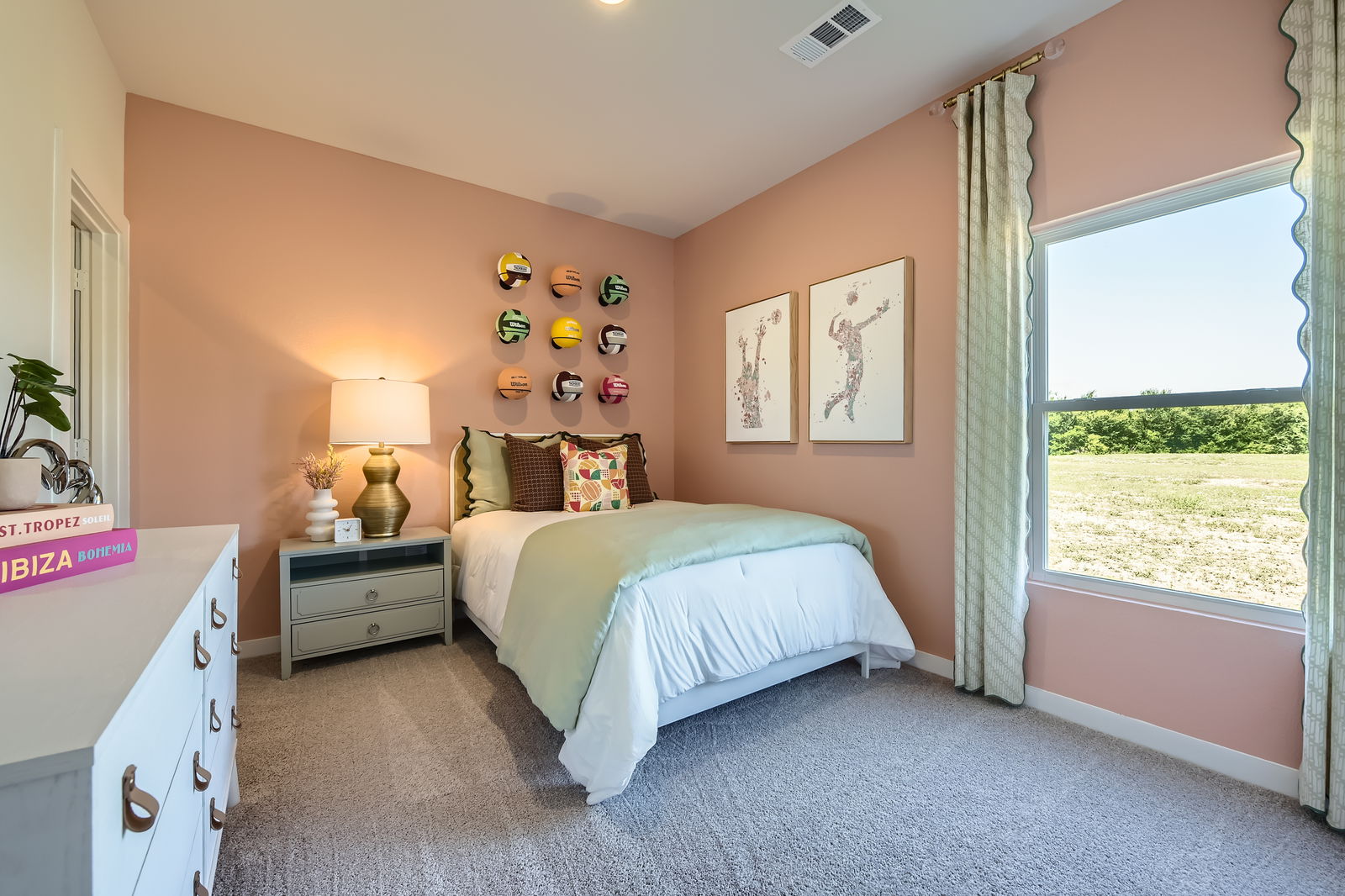 A bedroom with a large window.