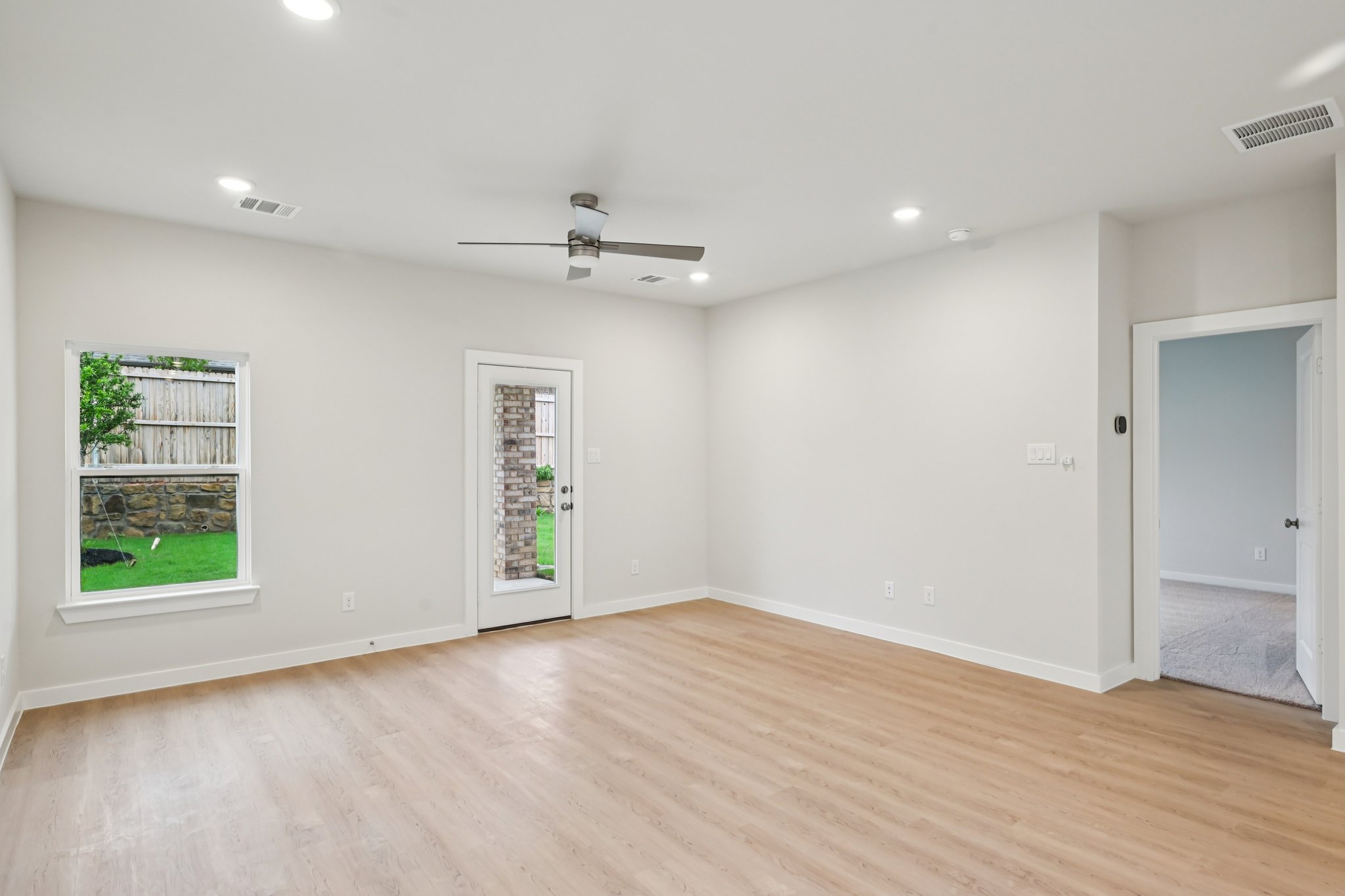 A room with a wood floor and a wood floor.