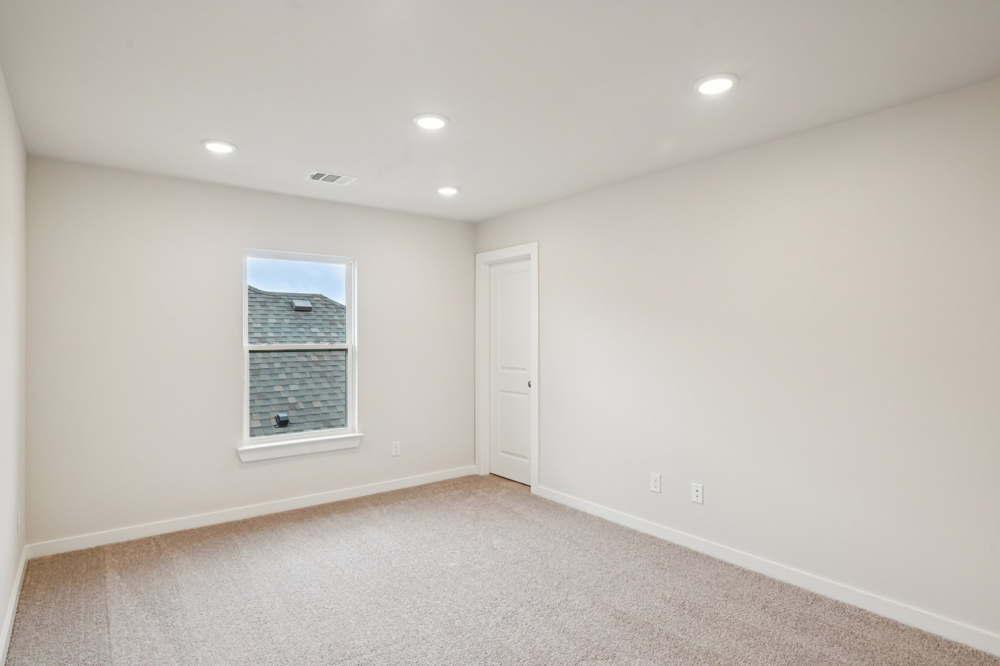 A room with a door and a window.