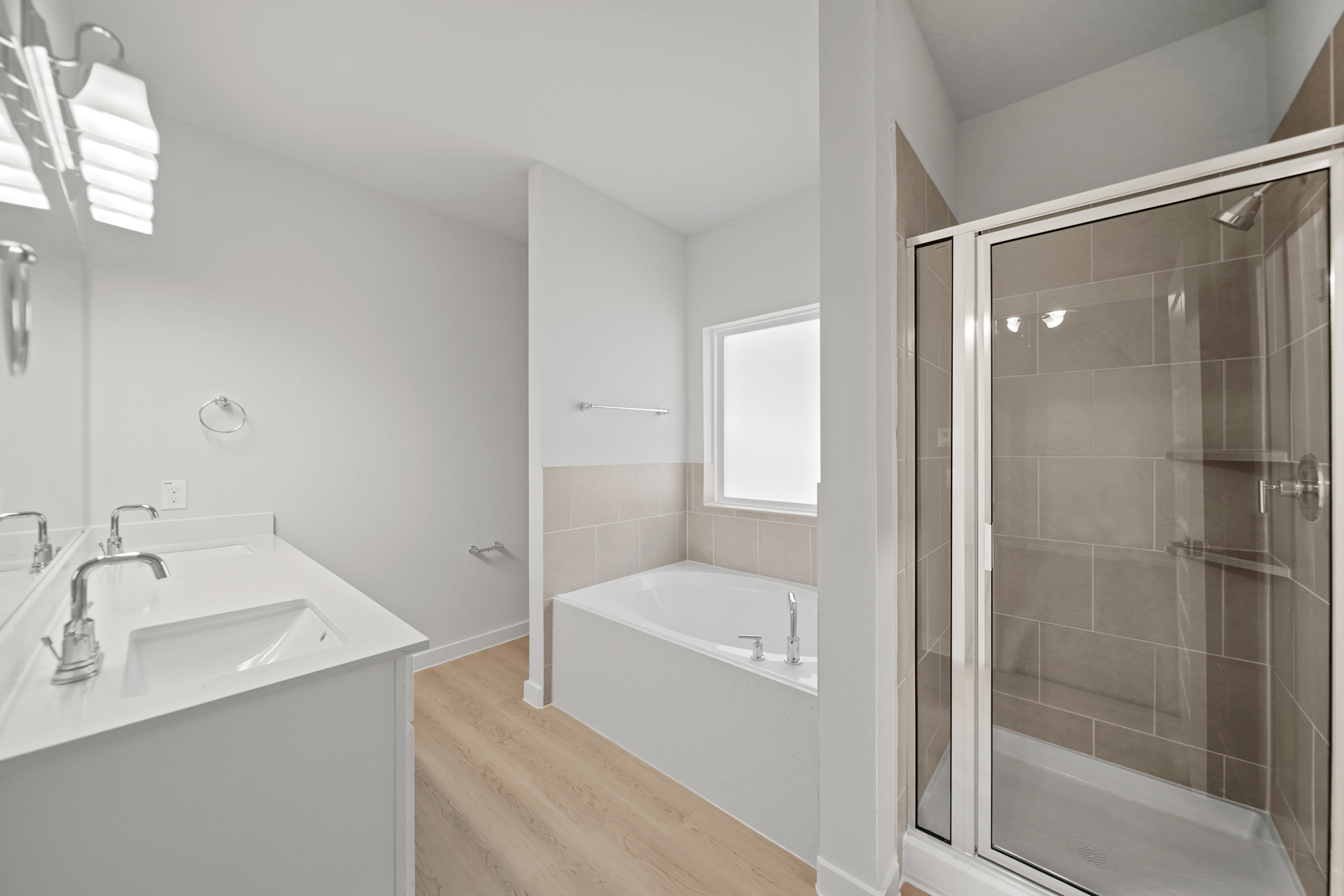 A bathroom with a tub and sink.