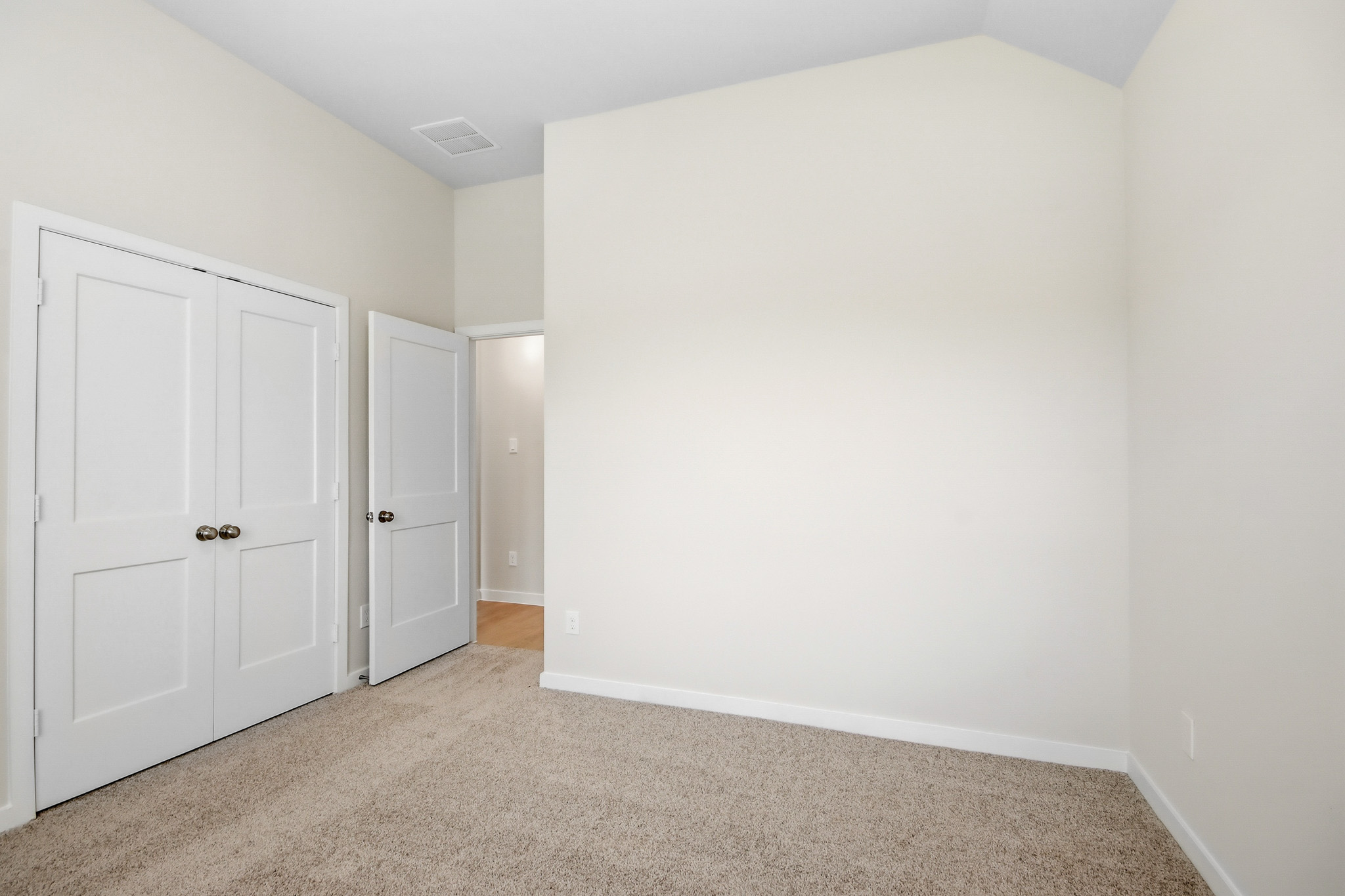 A room with white doors.
