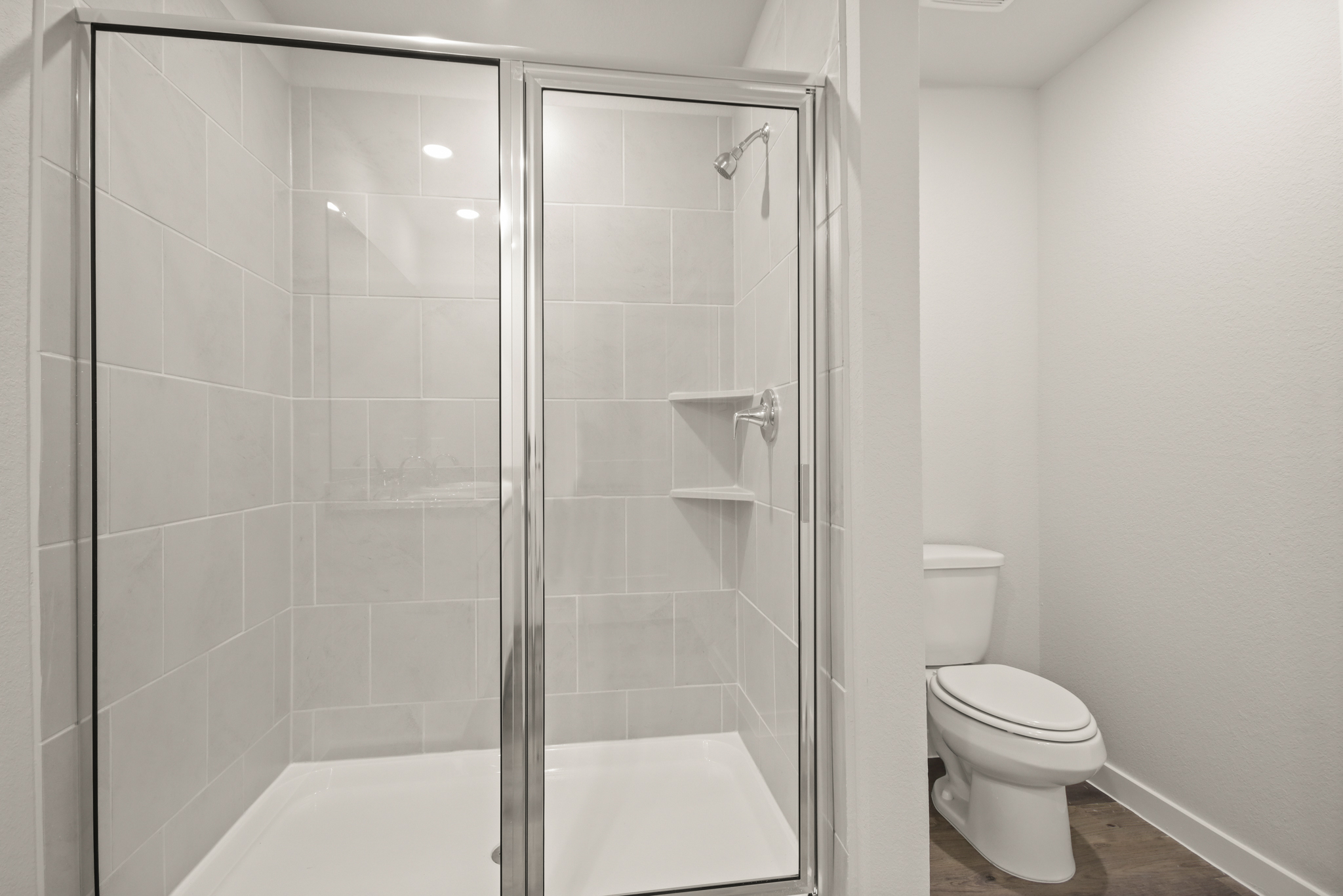 A bathroom with a glass shower.