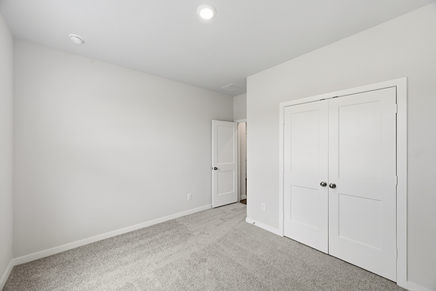 A room with white doors.