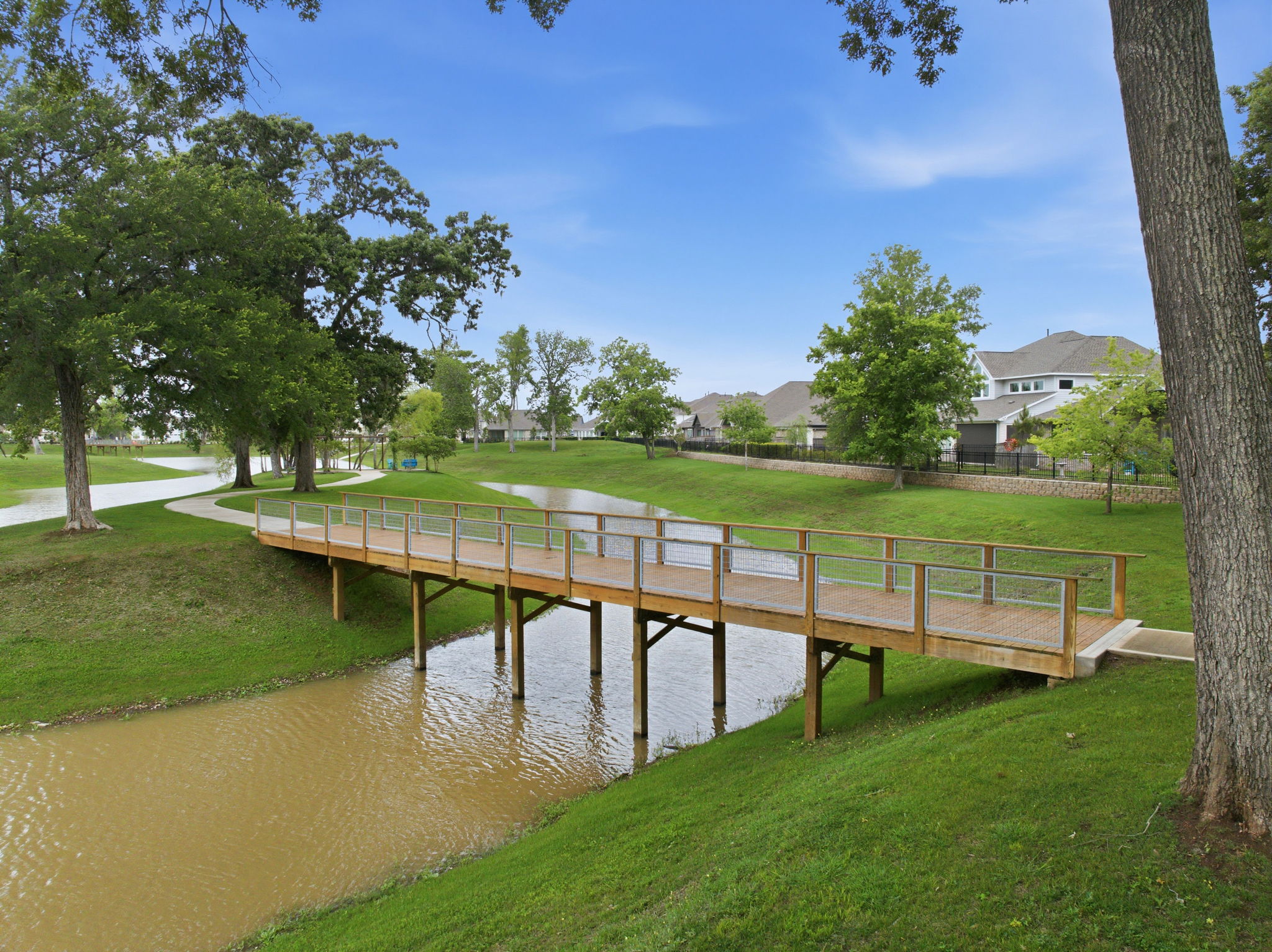 A wooden bridge over a river.