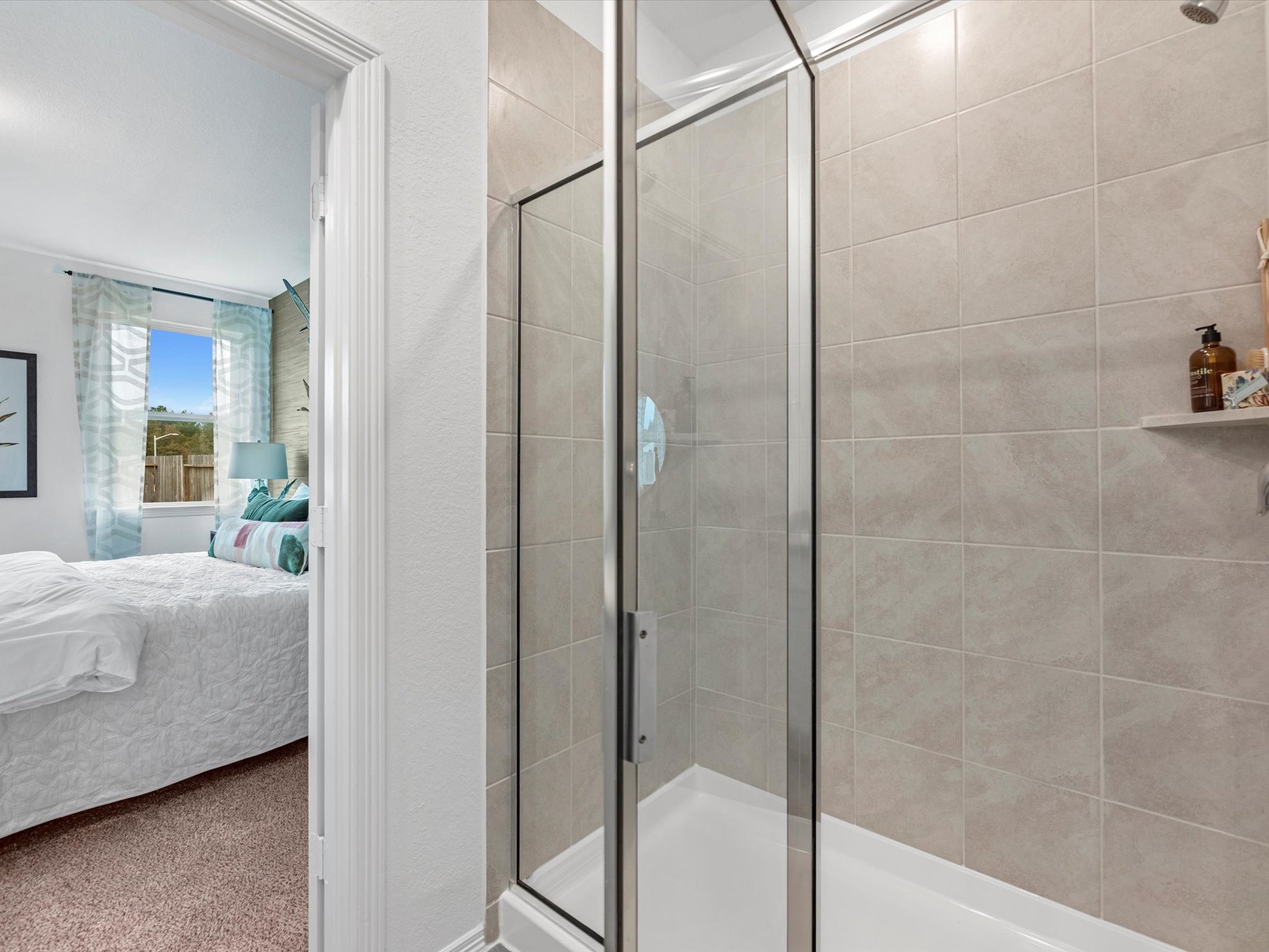 A bathroom with a glass shower.