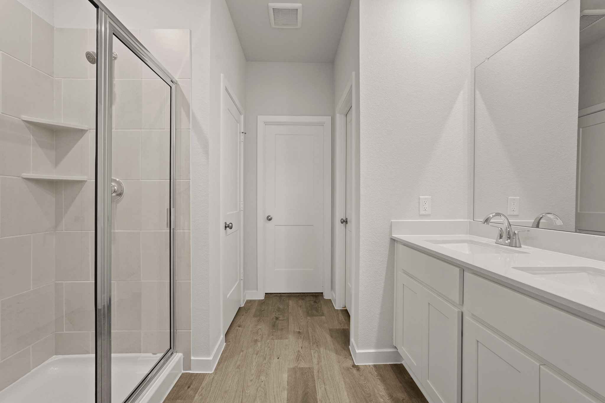 A bathroom with a glass shower.