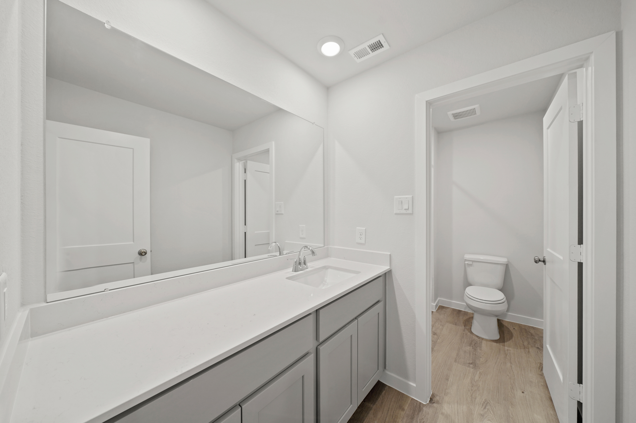 A bathroom with a tub sink and toilet.