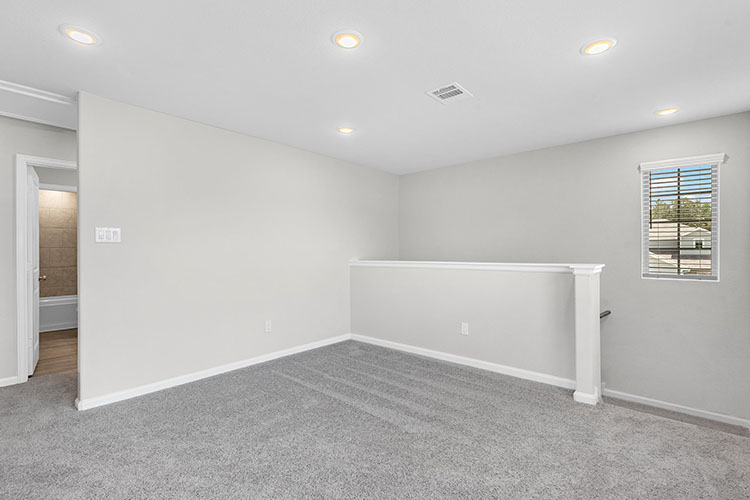 A room with a white wall and a white table.