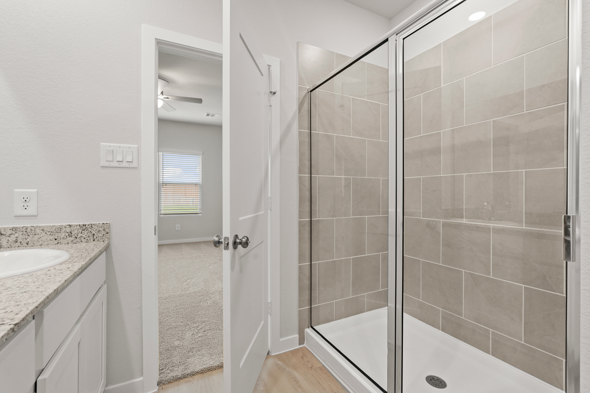 A bathroom with a glass shower.