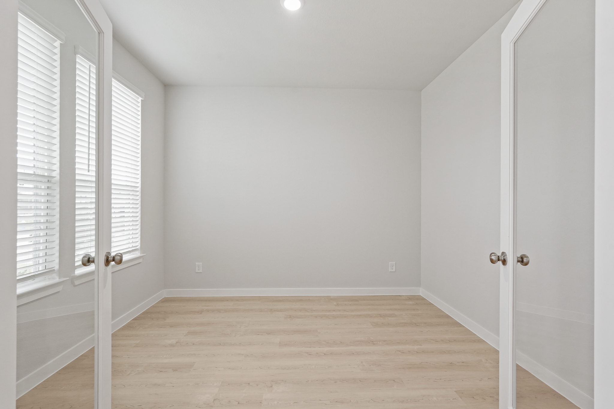 A room with white doors.