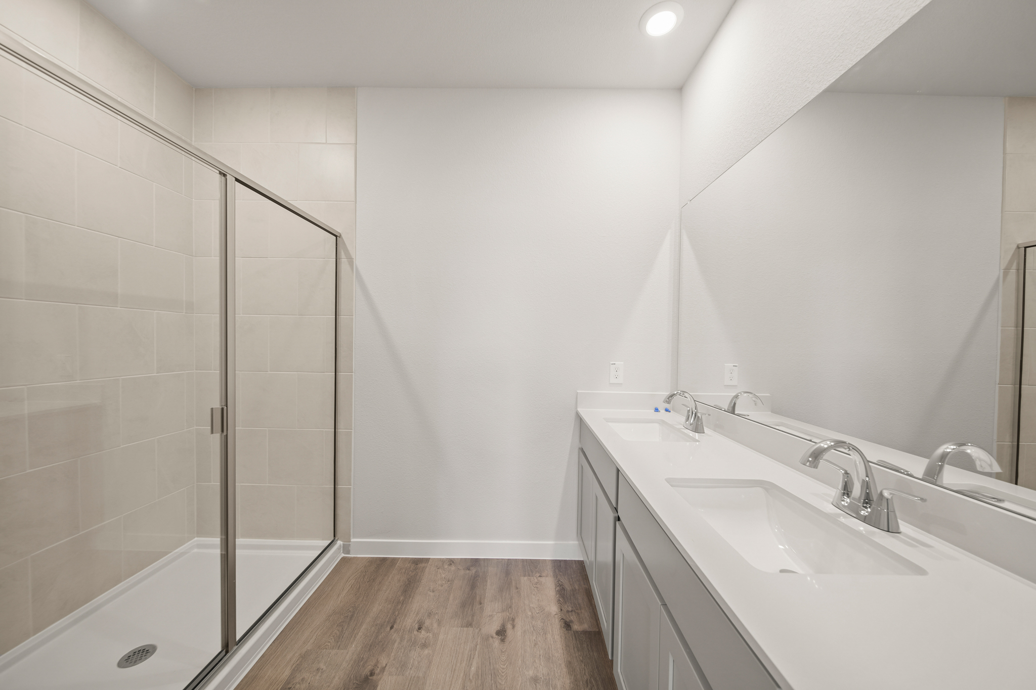 A bathroom with a glass shower.
