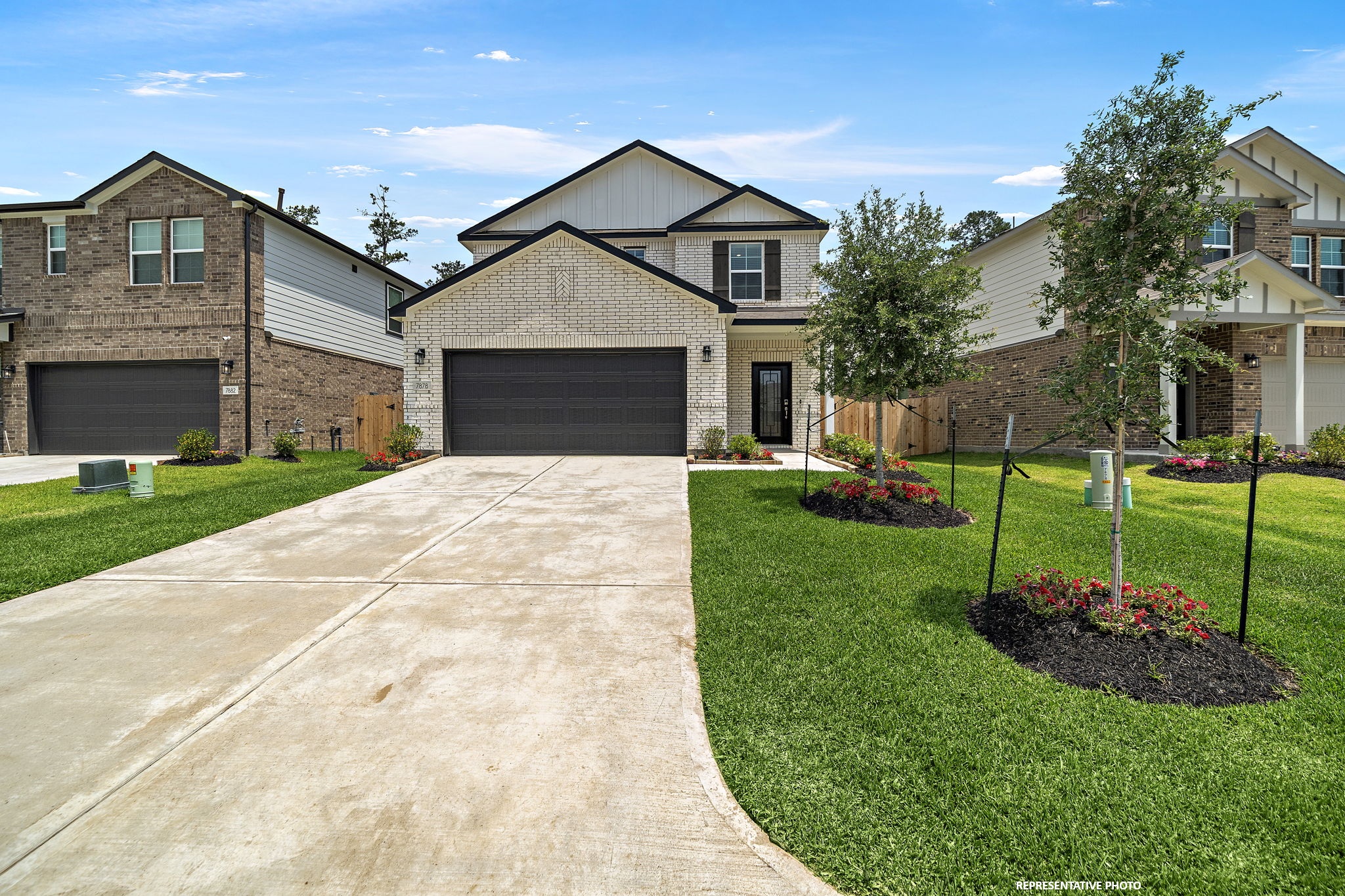A driveway leading to a house.