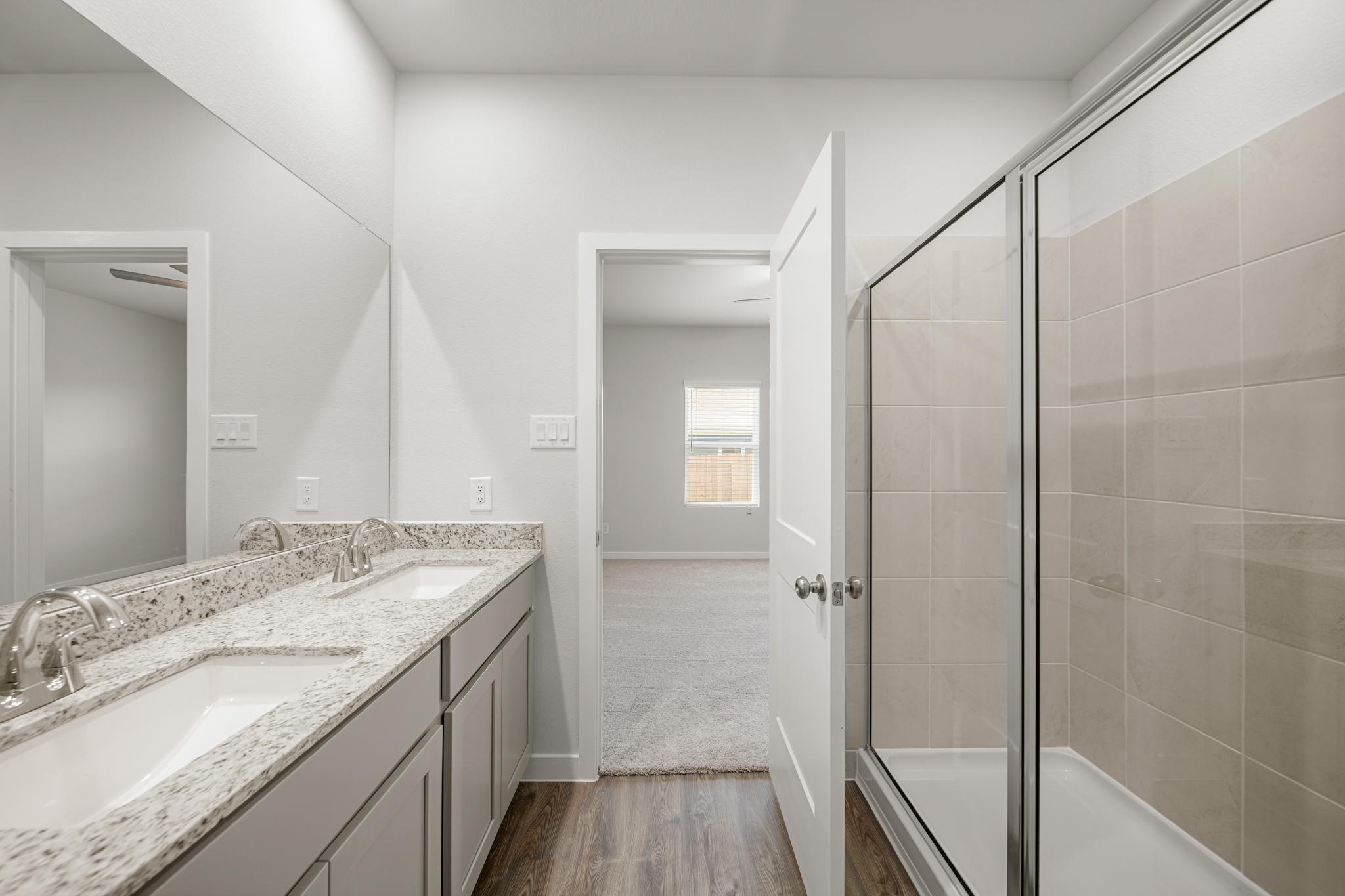 A bathroom with a glass shower.