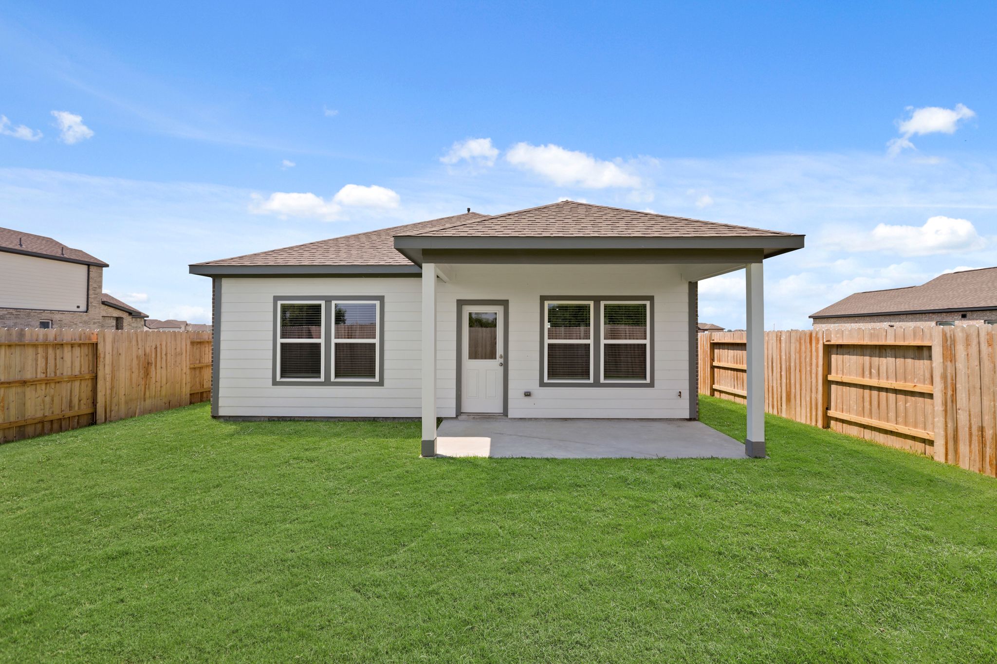 A house with a grass yard.