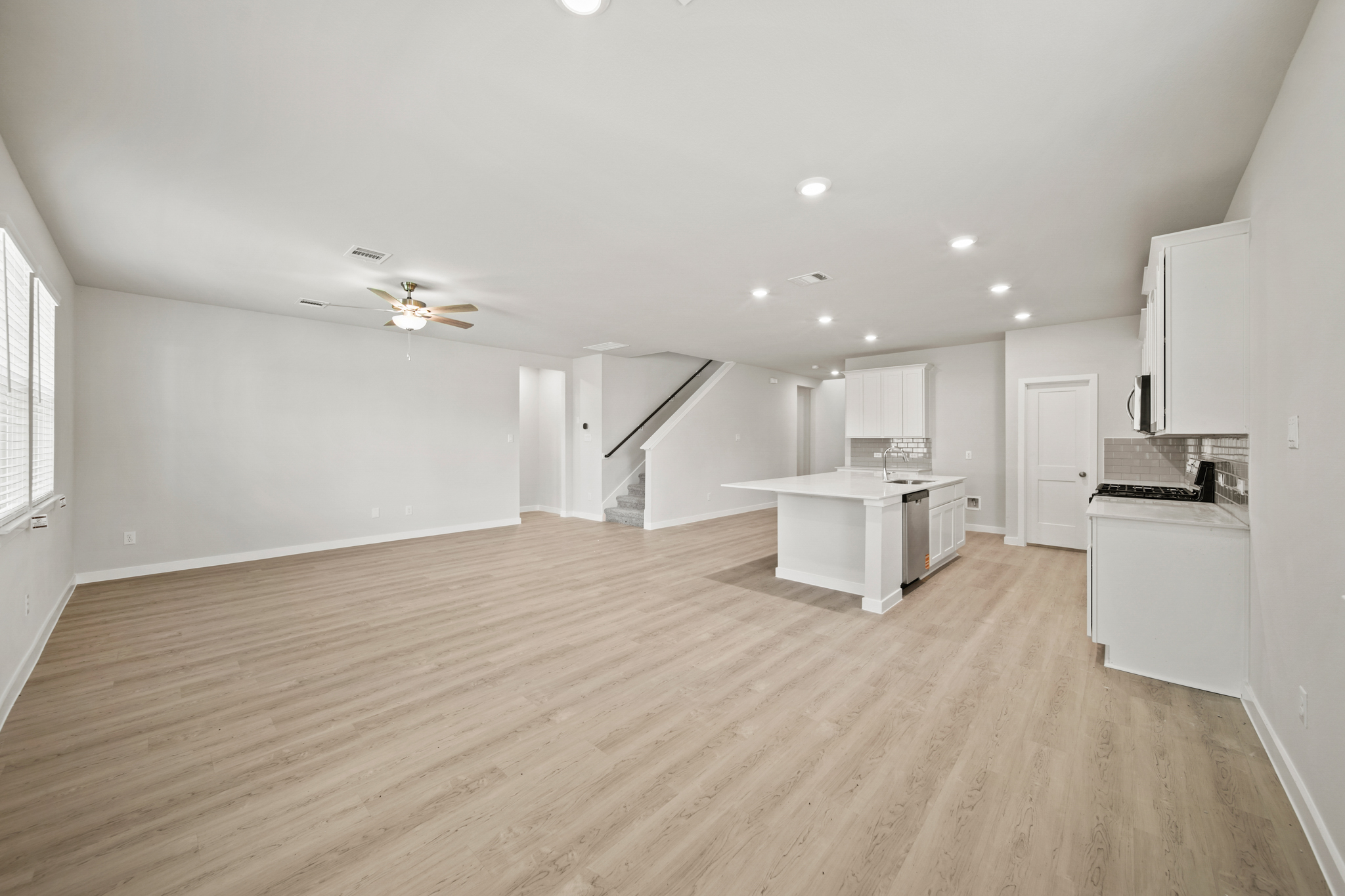 A large kitchen with white cabinets.