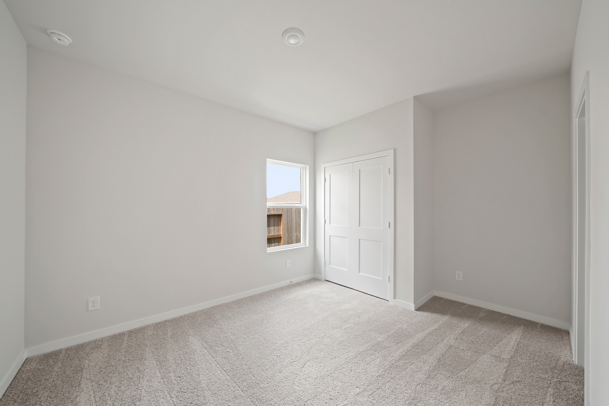 A room with a door and a window.