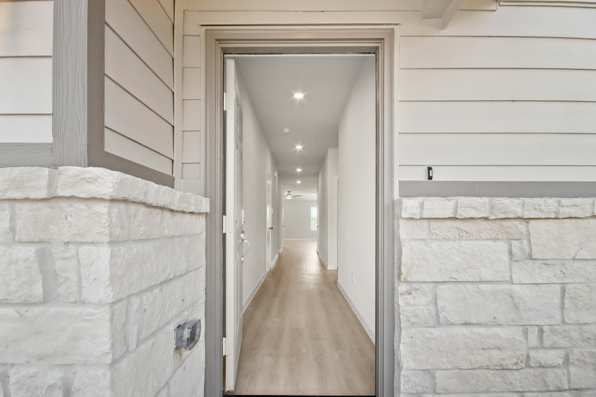 A hallway with stone walls.