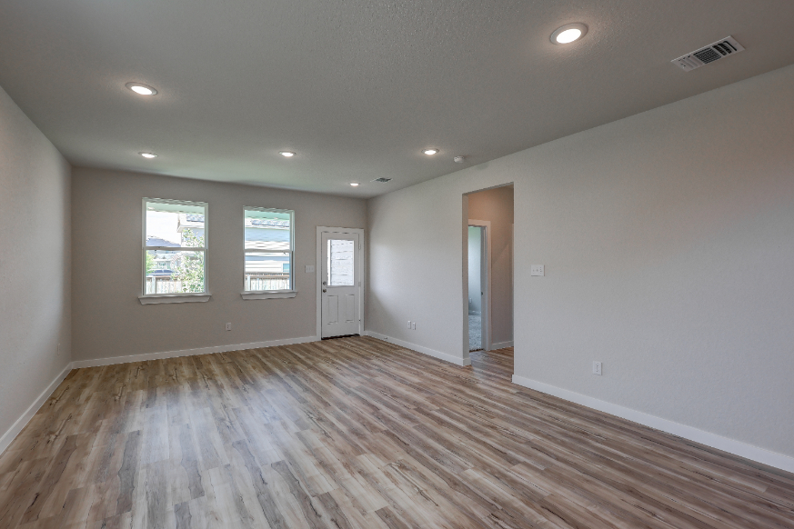 A room with a wood floor and a wood floor.