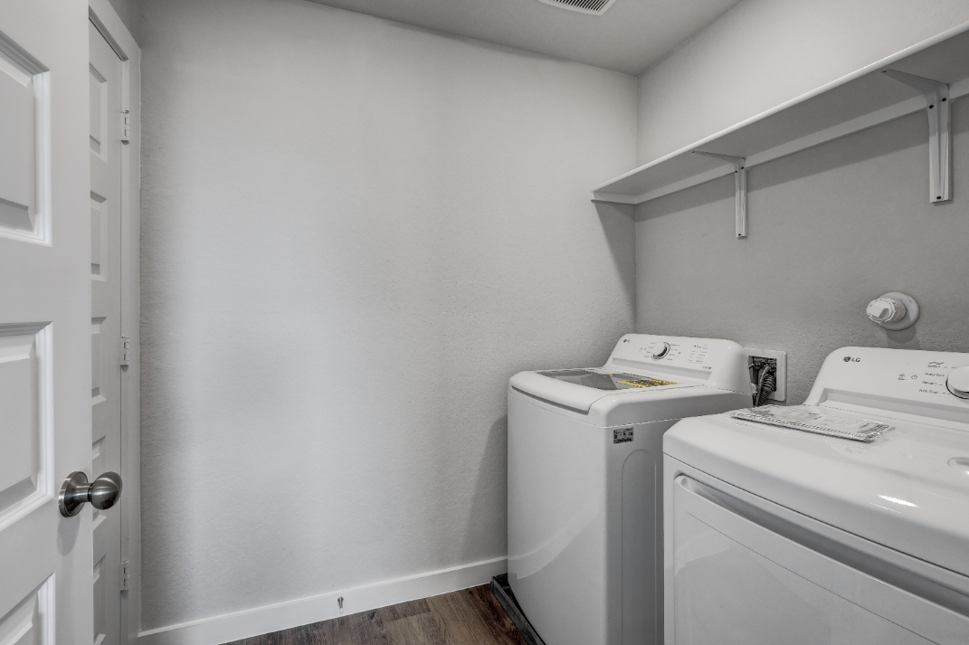 A washing machine in a room.