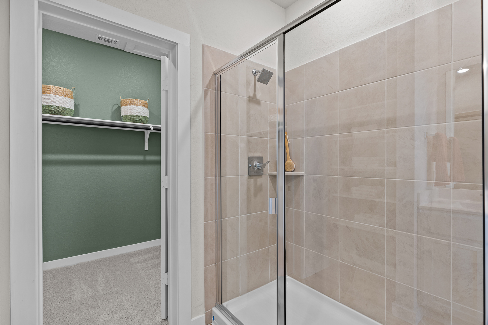 A shower with a glass door.