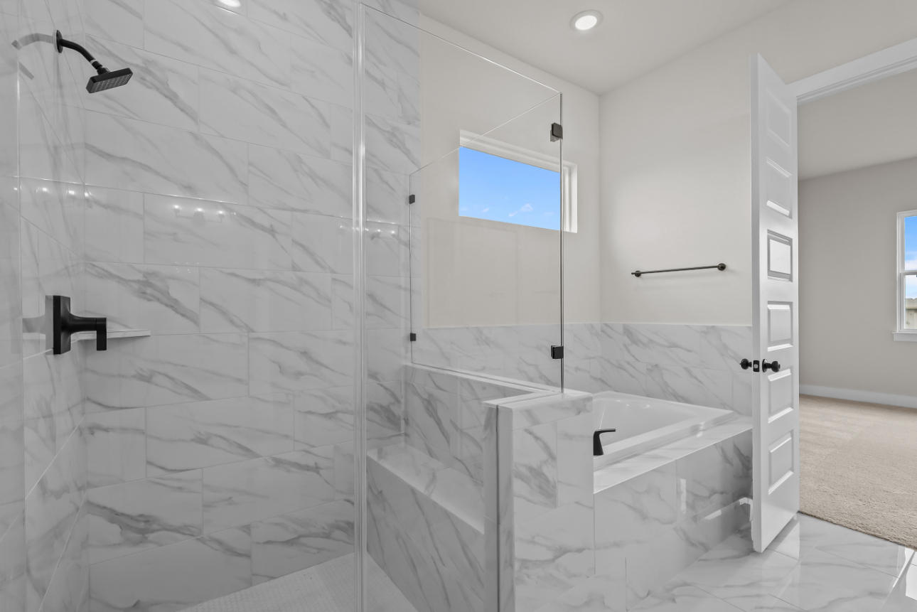 A bathroom with a glass shower.