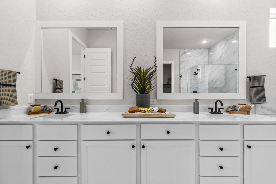 A white kitchen with white cabinets.
