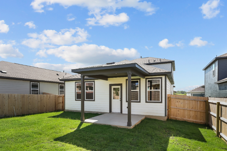A small house with a fence.