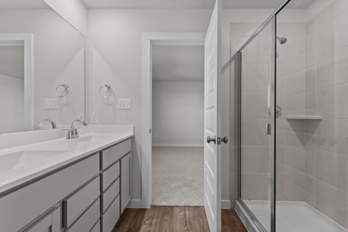 A bathroom with a glass shower.