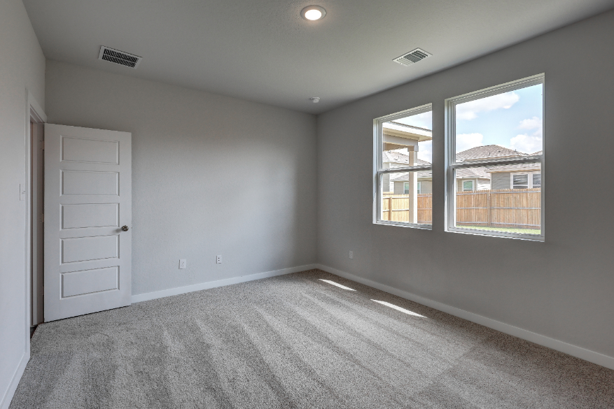 A room with a window and a door.