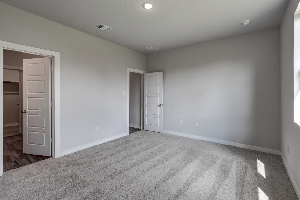 A room with white cabinets.
