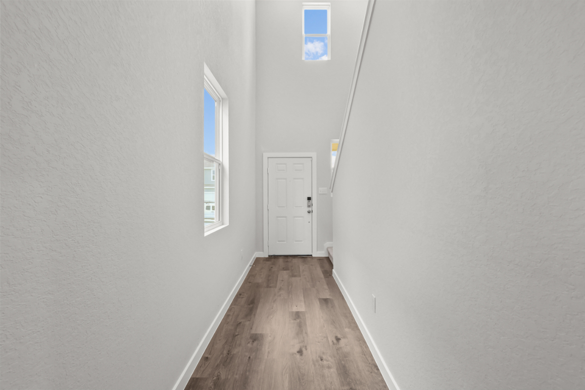 A hallway with white walls.