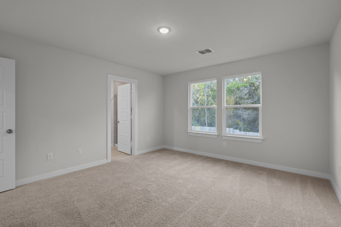 A room with a window and a door.