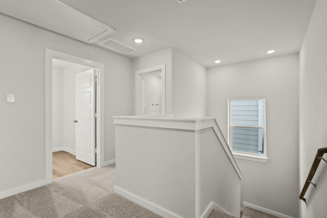 A white room with a white cabinet.